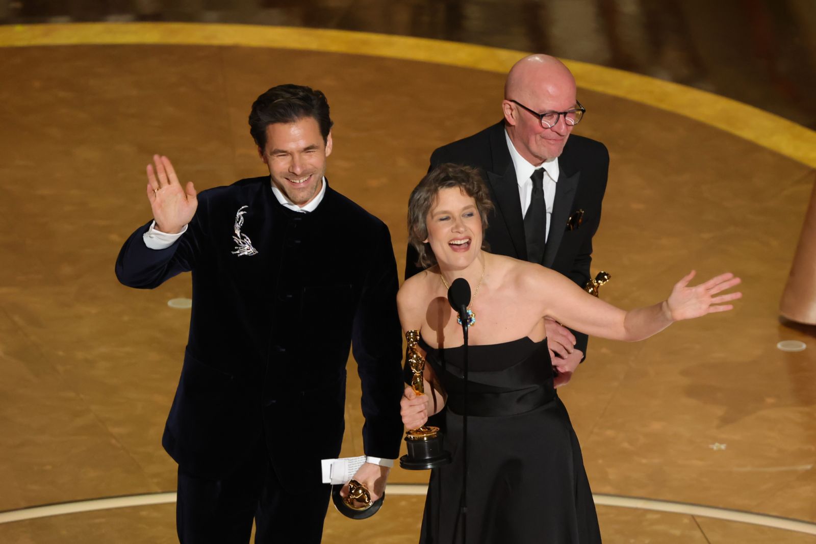 HOLLYWOOD, CALIFORNIA - MARCH 02: (L-R) Clément Ducol, Jacques Audiard and Camille Dalmais accept the Music Original Song award for 'El Mal' in "Emilia Pérez" onstage during the 97th Annual Oscars at Dolby Theatre on March 02, 2025 in Hollywood, California. (Photo by Kevin Winter/Getty Images)