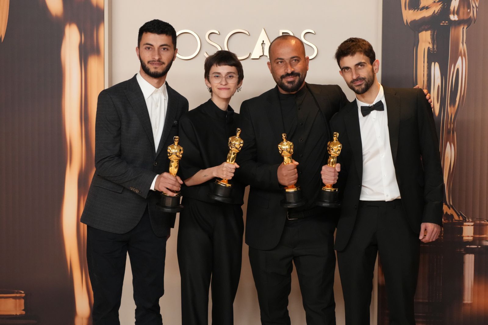 HOLLYWOOD, CALIFORNIA - MARCH 02: L-R) Basel Adra, Rachel Szor, Hamdan Ballal, Yuval Abraham, winners of the Best Documentary Feature Film for “No Other Land”, pose in the press room during the 97th Annual Oscars at Dolby Theatre on March 02, 2025 in Hollywood, California. (Photo by Jeff Kravitz/FilmMagic)