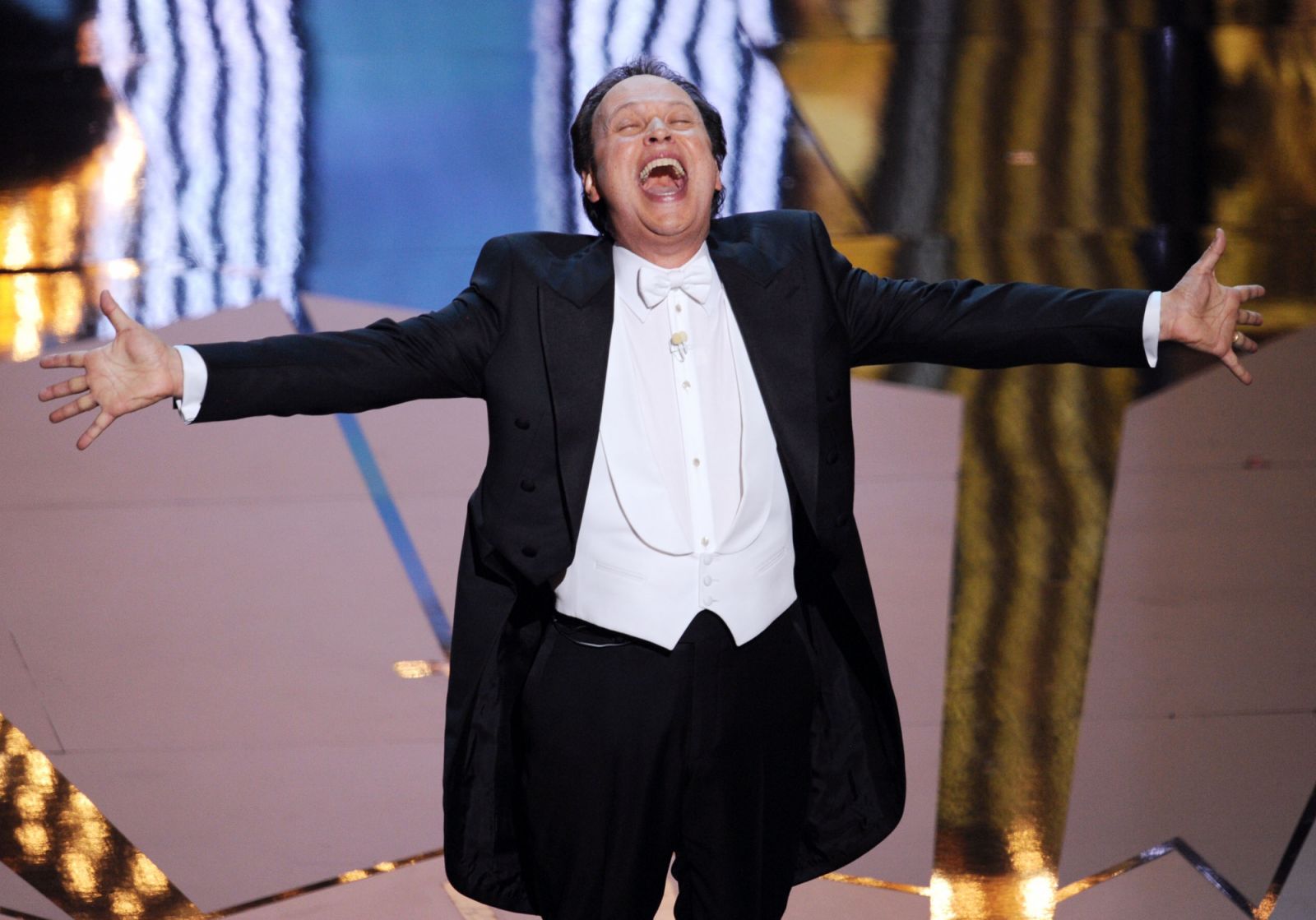 Host Billy Crystal performs onstage during the 84th Annual Academy Awards held at the Hollywood & Highland Center on February 26, 2012 in Hollywood, California. (Photo by Kevin Winter/Getty Images)