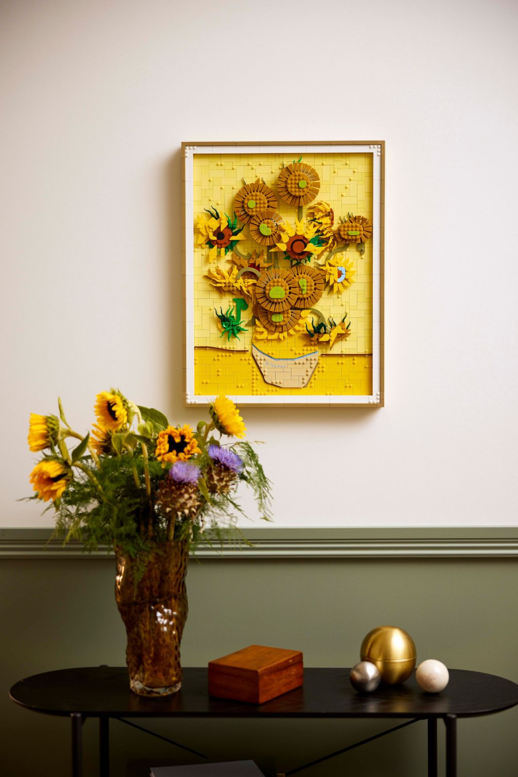 Displayed on a wall above a console table, the Lego Sunflowers set complements contemporary home décor