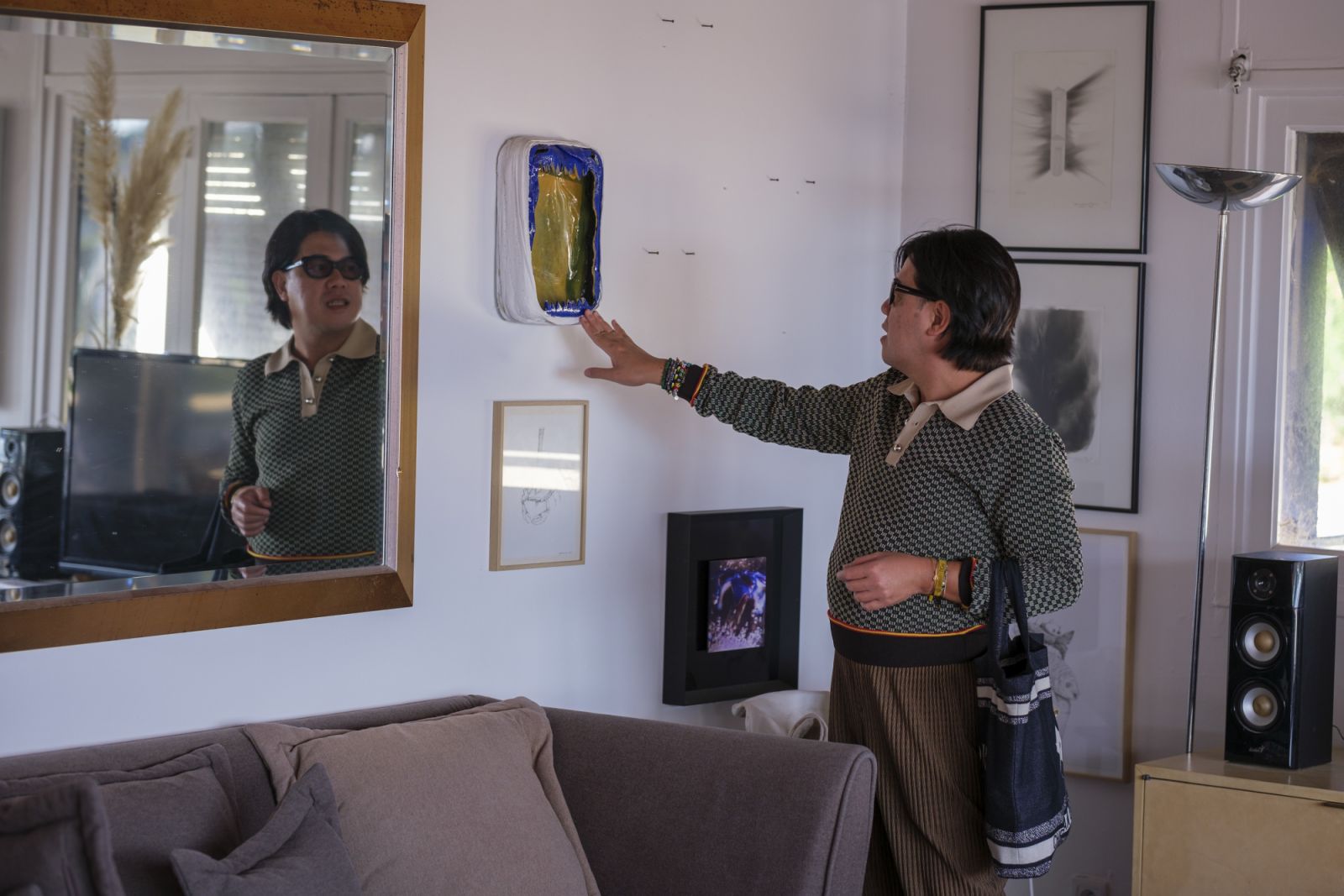 Ian Giron of Siargao Artiste in Residence checks the works at Port Tonic Art Centre (Photo: Port Tonic)