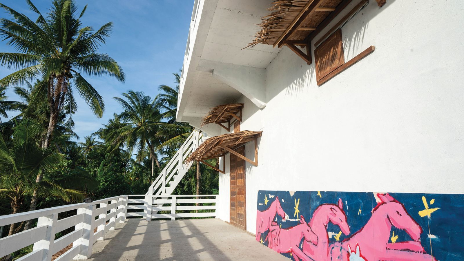 Siargao Artiste in Residence gallery with horses painted outside by Juan Perdiguero Trillo