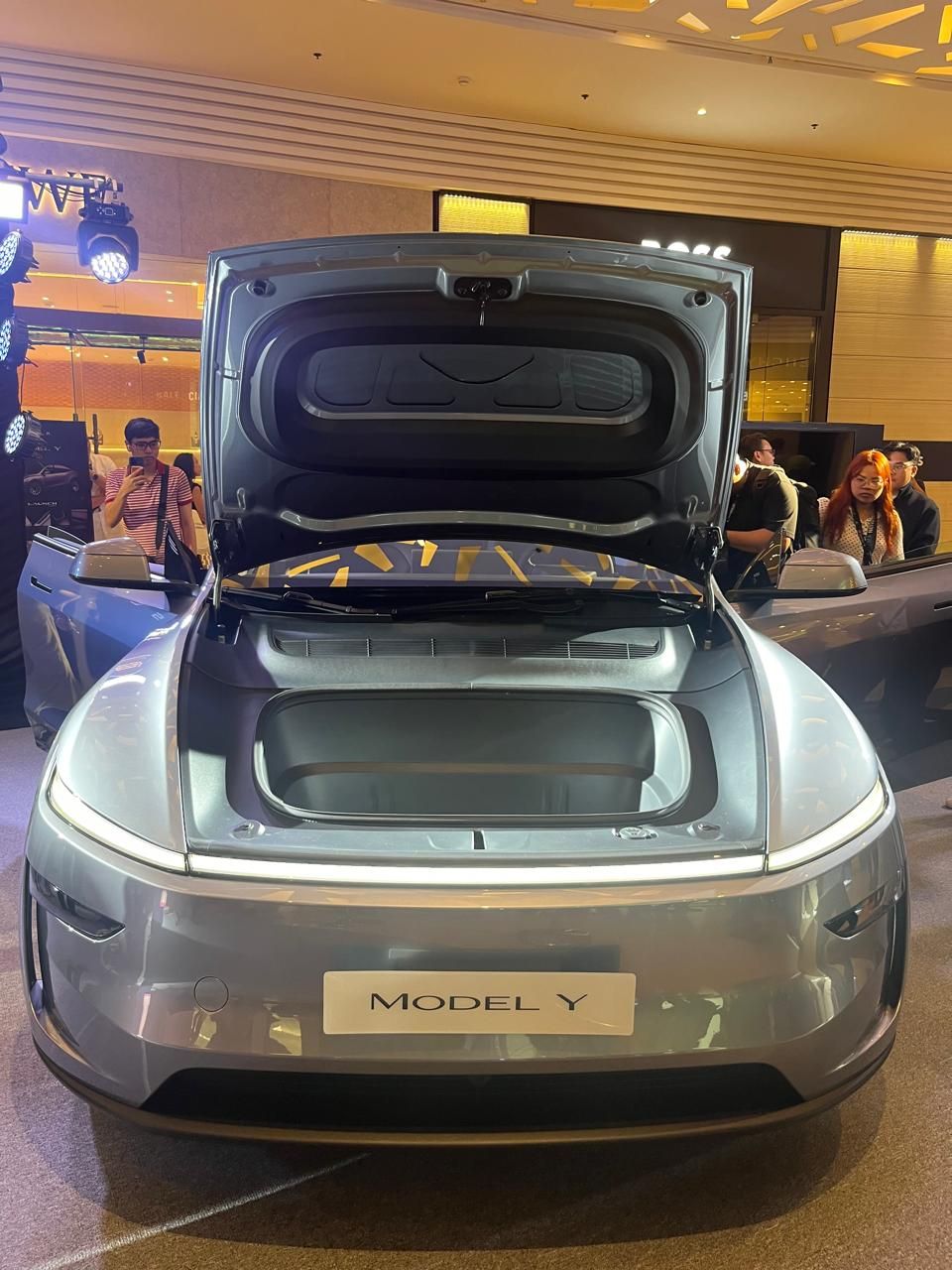 The Tesla New Model Y with its frunk open