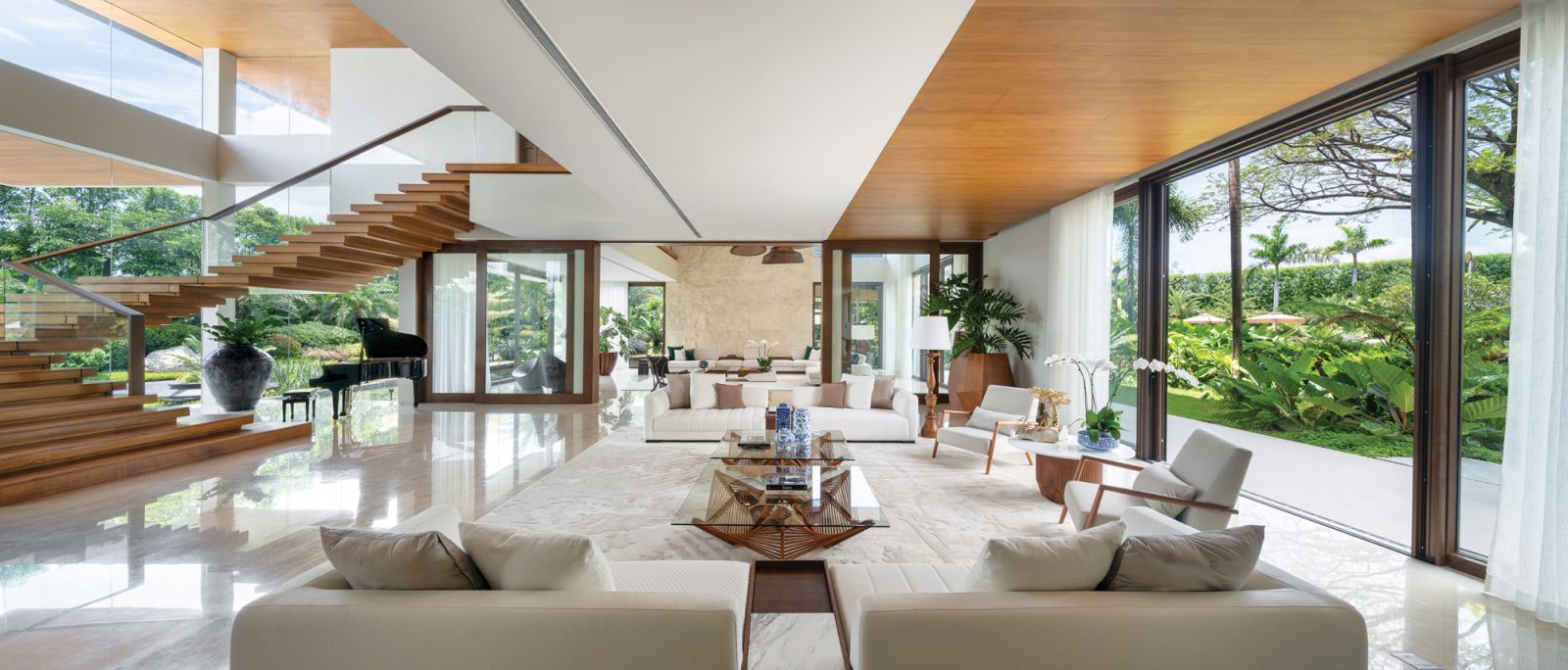 The front entrance on the left opens into two spacious living rooms with furniture by noted artisans from all over the country and a stairway leading to the private theatre on the second floor