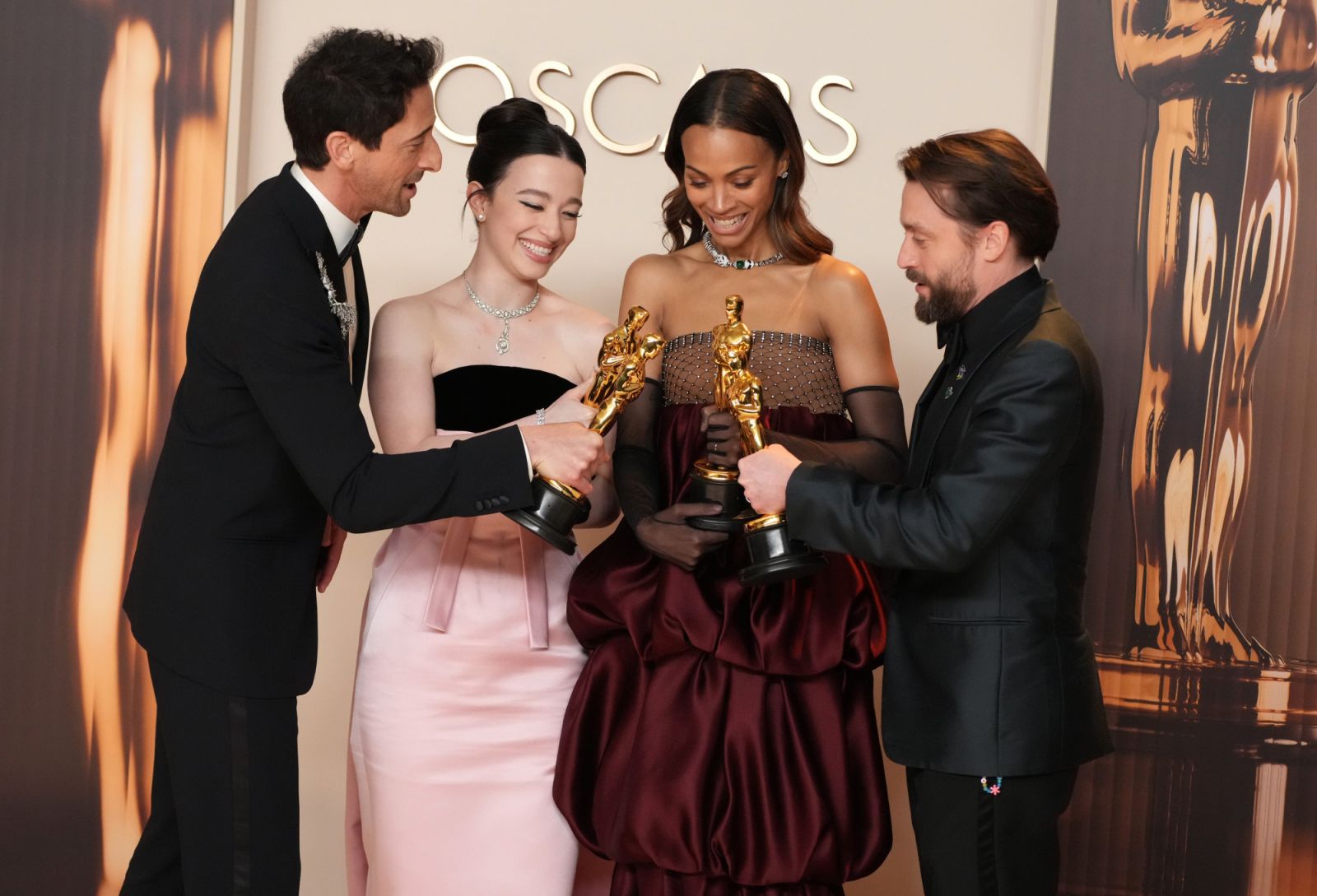 HOLLYWOOD, CALIFORNIA - MARCH 02: (L-R) Adrien Brody, winner of the Best Actor in a Leading Role for “The Brutalist”, Mikey Madison, winner of the Best Actress in a Leading Role for “Anora”, Zoe Saldaña, winner of the Best Actress in a Supporting Role for “Emilia Pérez”, and Kieran Culkin, winner of the Best Actor in a Supporting Role for “A Real Pain”, pose in the press room during the 97th Annual Oscars at Dolby Theatre on March 02, 2025 in Hollywood, California. (Photo by Jeff Kravitz/FilmMagic)