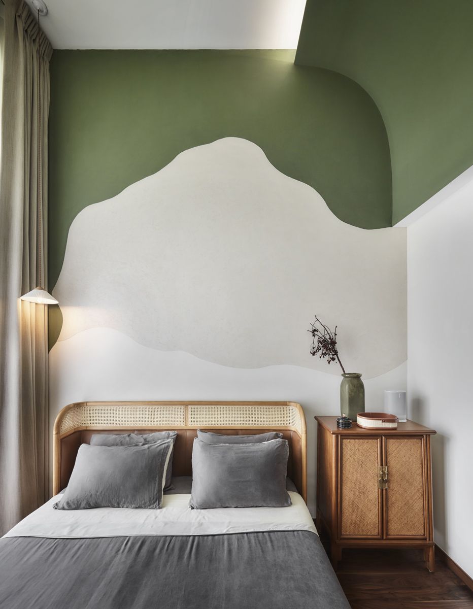 The abstract mountain motifs found throughout the home, such as in this bedroom, were inspired by the movie Seven Years in Tibet