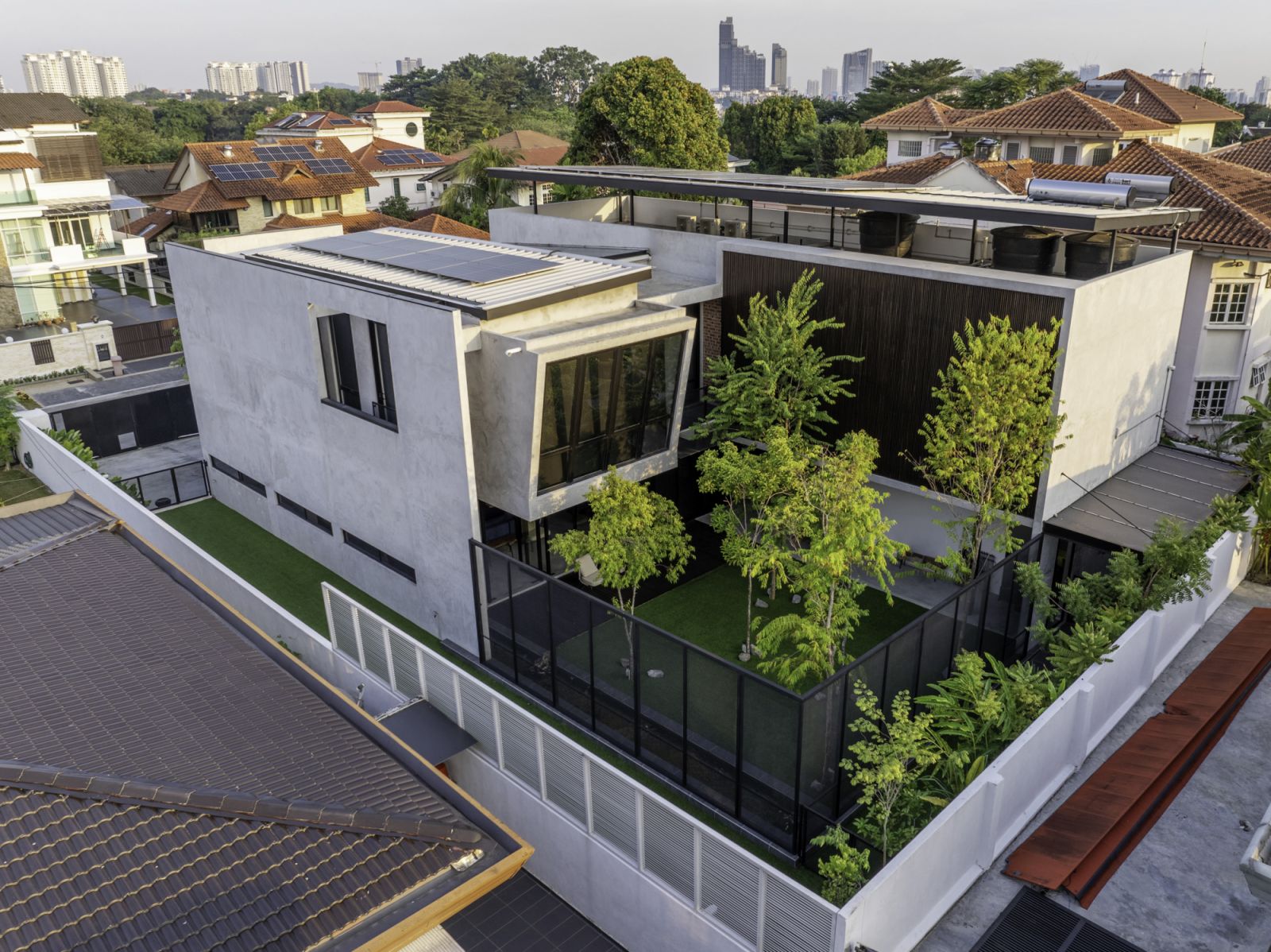 The Interlace House features interlocking rectangular volumes, creating a pocket courtyard