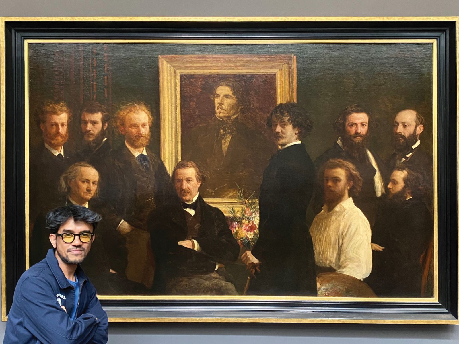 Mark Nicdao beside ‘Hommage to EugeneDelacroix’ by one of his favourite painters, Henry Fantin-Latour, at Musee d’Orsay in Paris (Photo: Courtesy of Mark Nicdao)