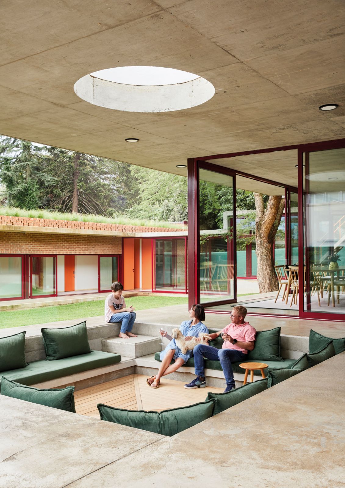 This outdoor entertainment area off the home’s living space includes some ‘70s influences such as the sunken lounge