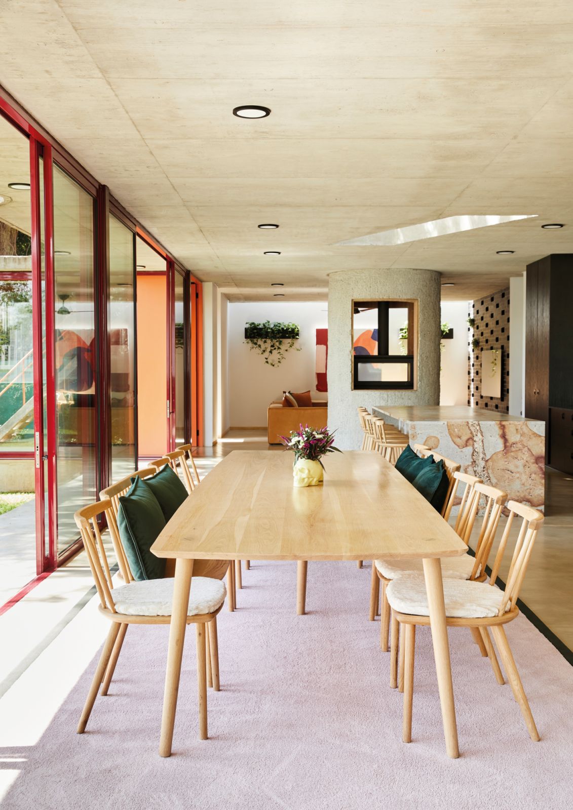The dining table, chairs and stools at the kitchen island were all sourced from local furniture manufacturer Houtlander