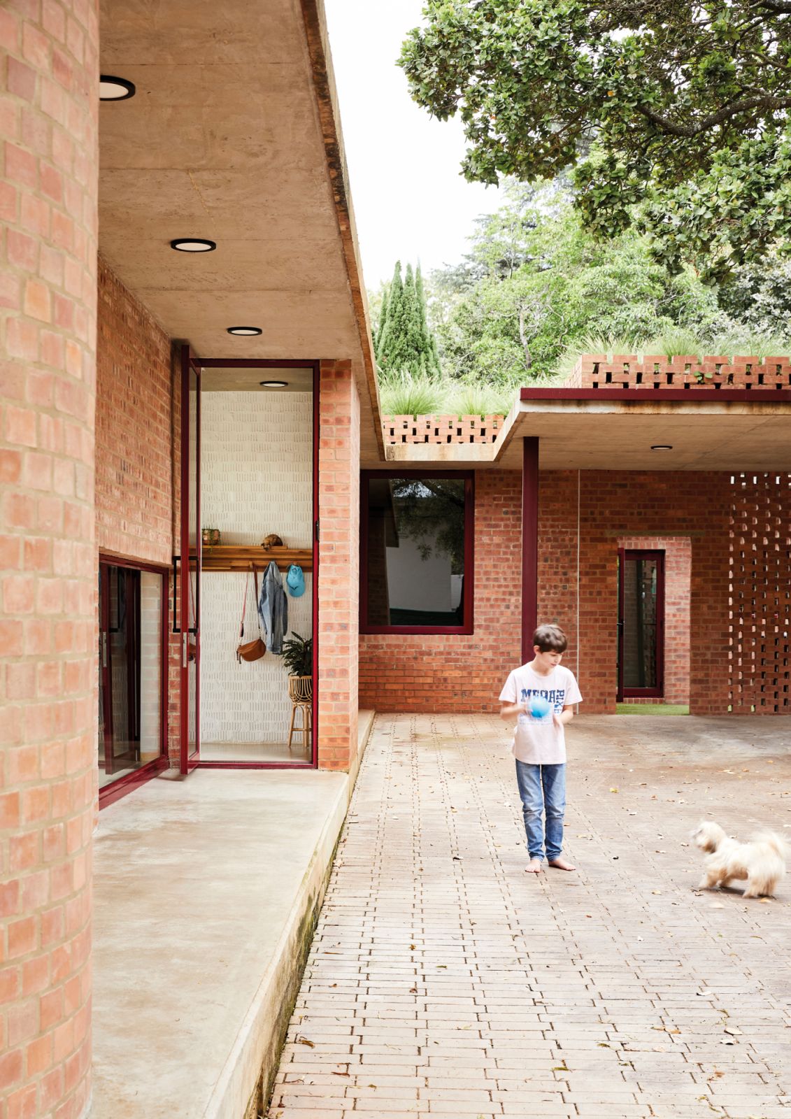 The entrance is discreetly tucked away off the driveway