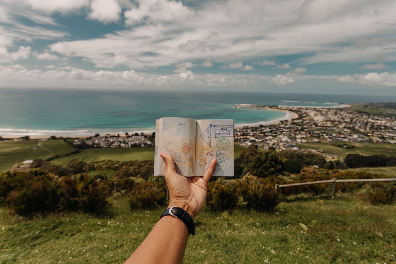 Asian male holding passport