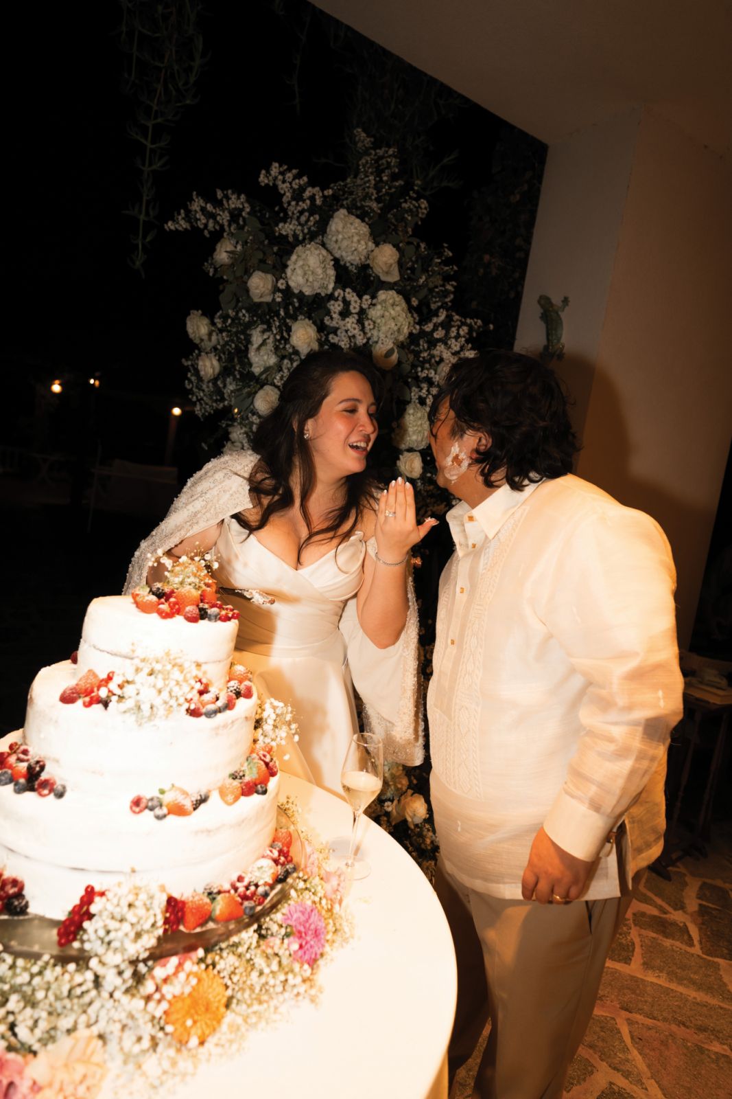 Raul and Audrey cutting the wedding cake