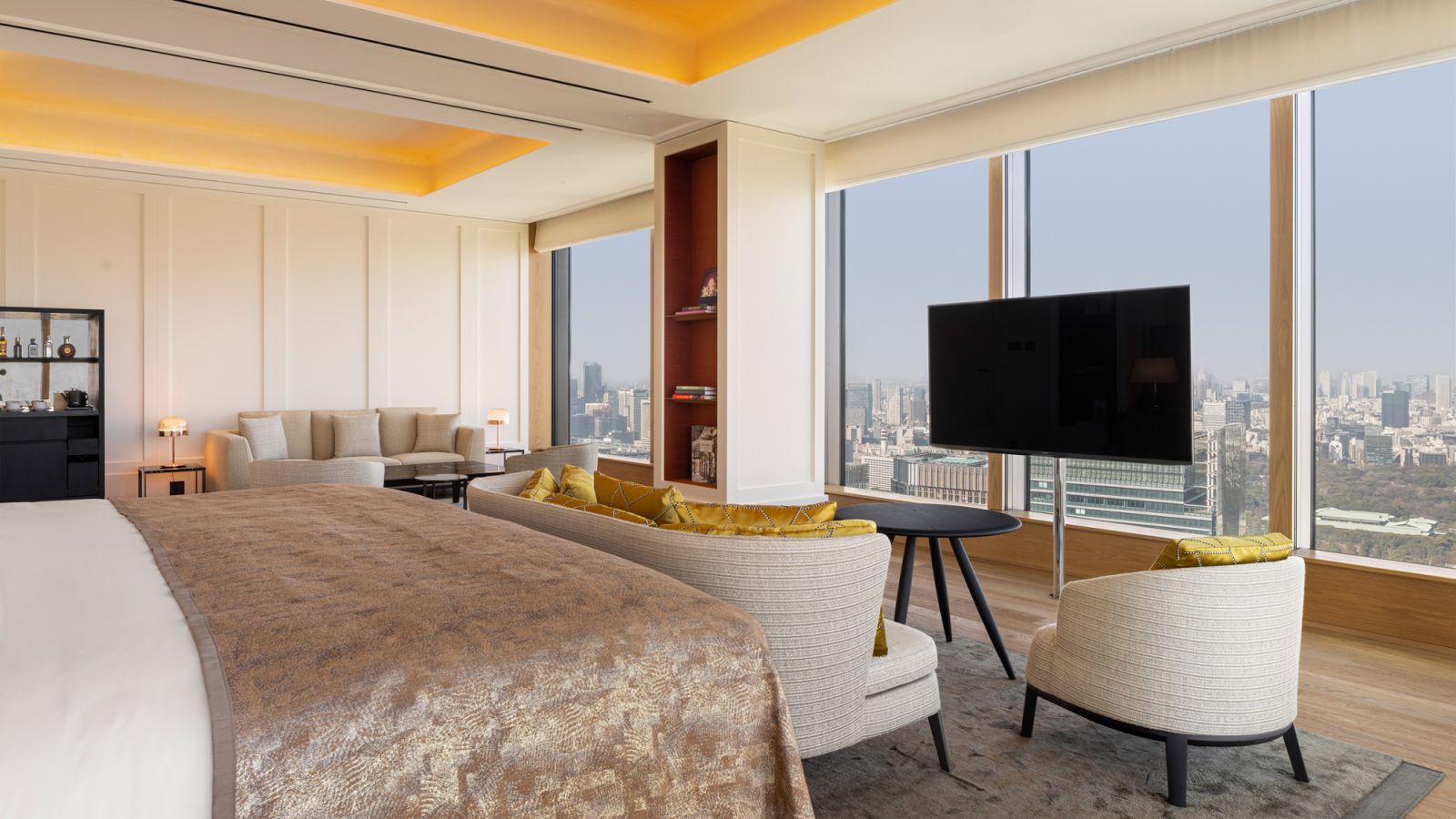 Guests have a choice to watch TV, admire the sweeping skyline, or both, from the comfort of the bed