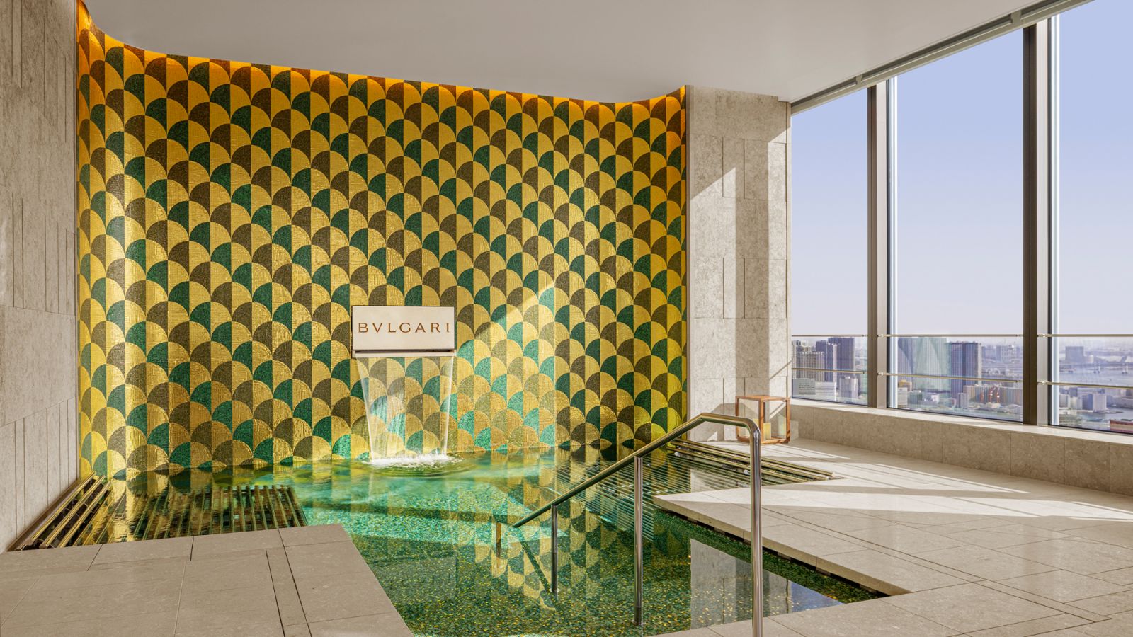 Graphic tiles provid a stunning backdrop to this pool