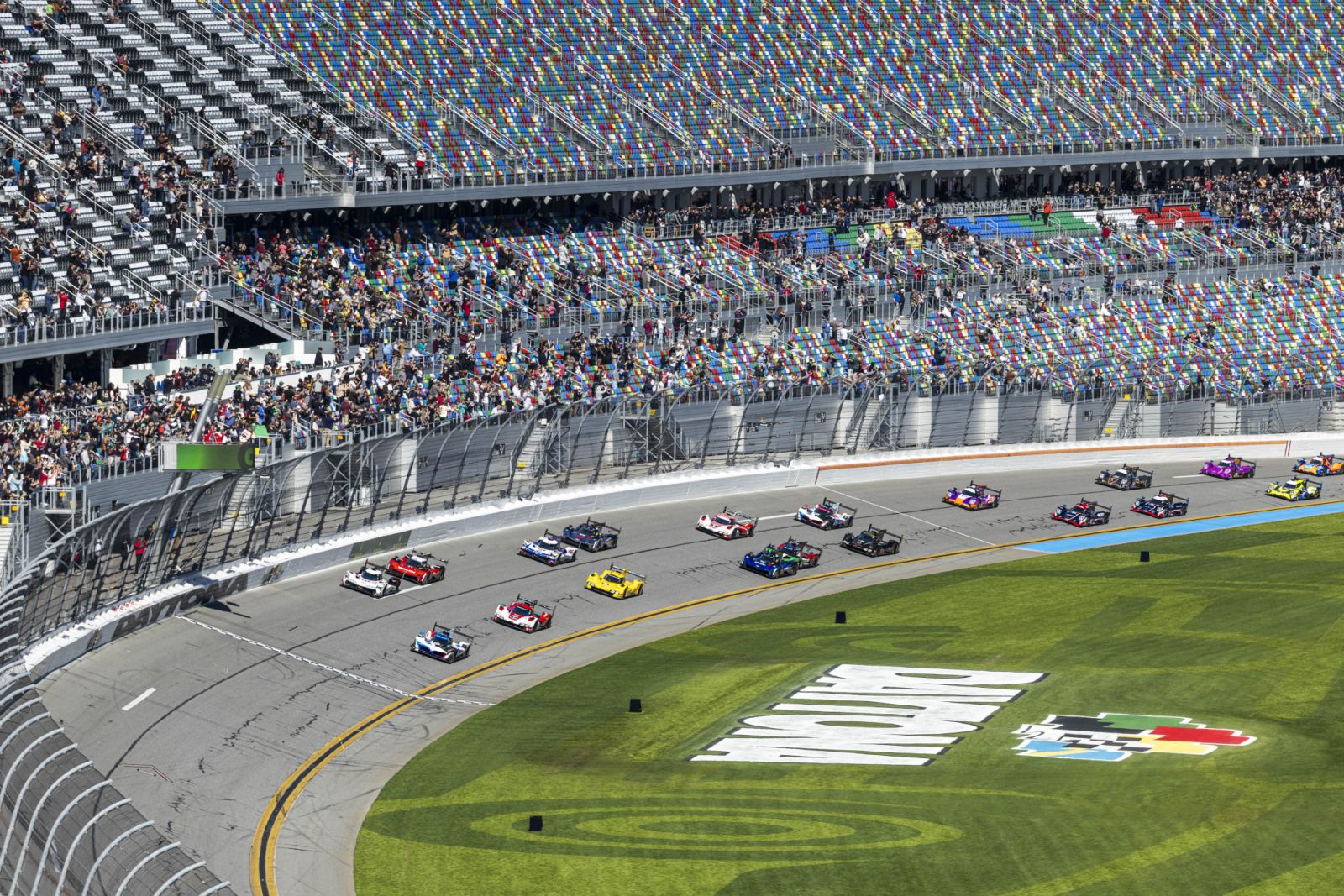 The green flag waves to start the 2025 Rolex 24 at Daytona.