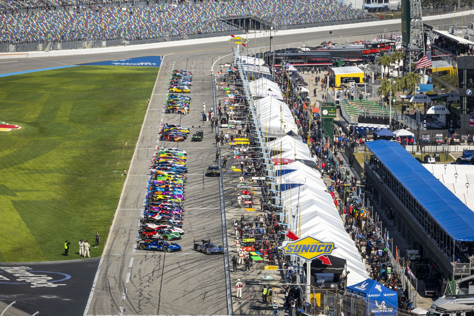 The field lines for pre-race ceremonies in during the 2025 Rolex 24 at Daytona.