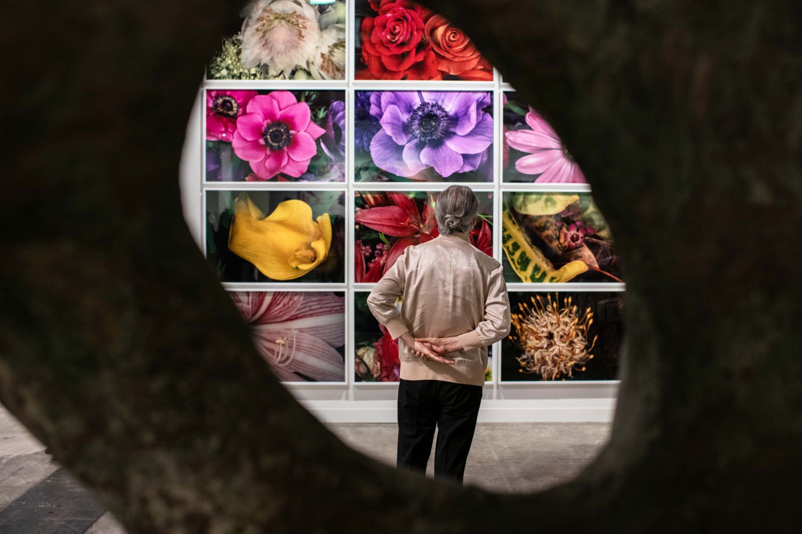 HONG KONG, CHINA - MARCH 29: A guest views an artwork at Art Basel Hong Kong on March 29, 2024 in Hong Kong, China. (photo by Ivan Abreu/Getty Images)