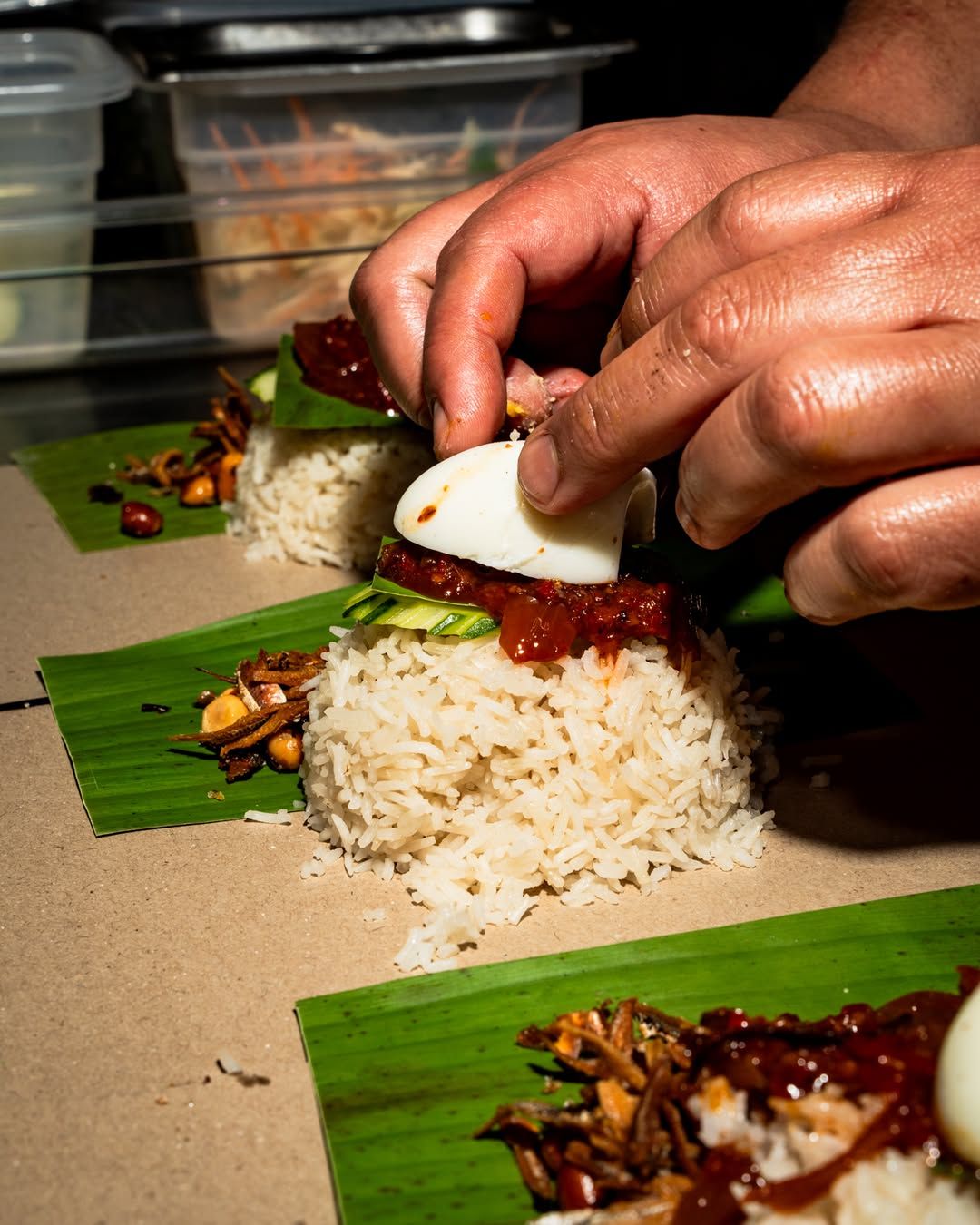 Nasi lemak bungkus in the making (Image: @sudu.ldn)