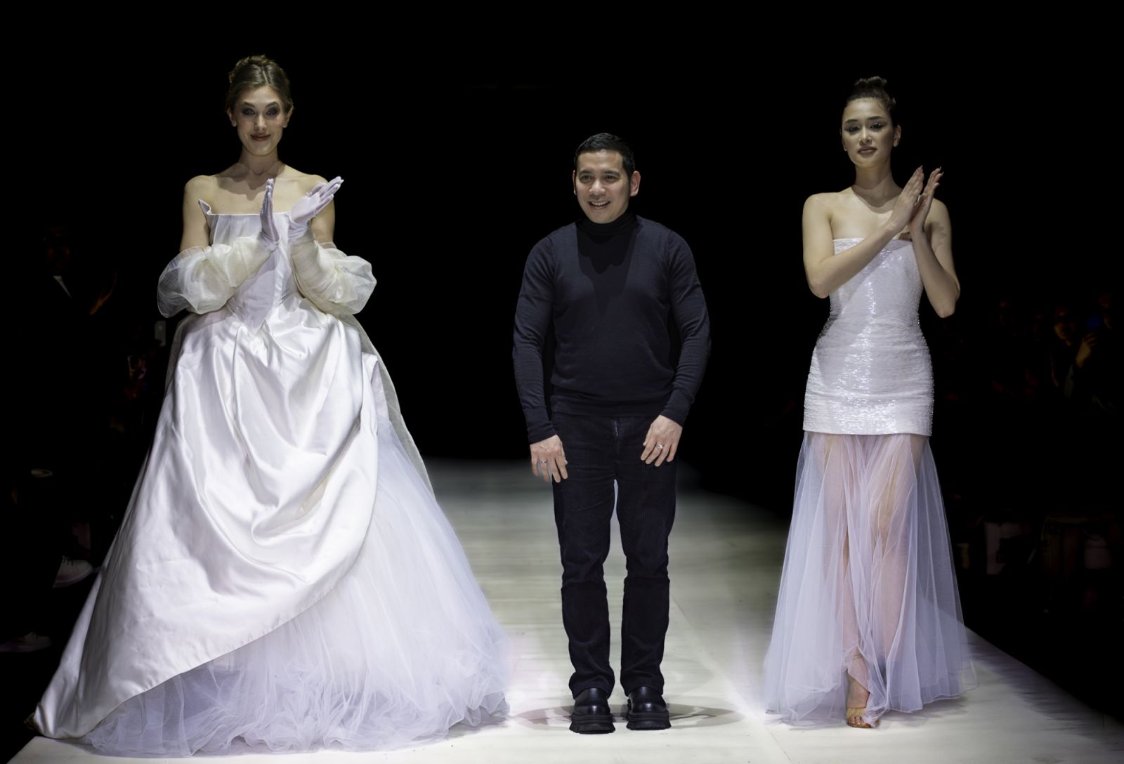 Filipino designer John Herrera poses with his finale pieces at his Paris Fashion Week debut (Photo: Paris City Fashion Week)