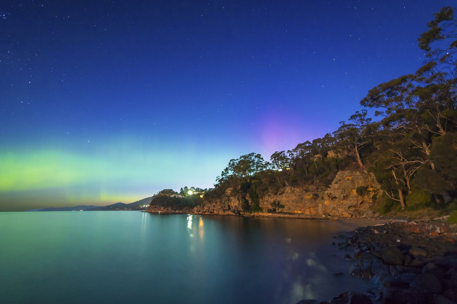 I headed to Boronia Reserve, south of Hobart, Tasmania, last night to get some shots of the Milky Way since the sky was really clear. I went out early as I knew the moon was rising at 9:50pm, and was hoping to get at least some complete darkness between sunset and moonrise. When I saw the moon rising due East, I looked South, there was still a fair bit of light from the sun going down. I thought the whole trip was a waste, until I realised there was an aurora going on. So, despite the gorgeous moonrise whic