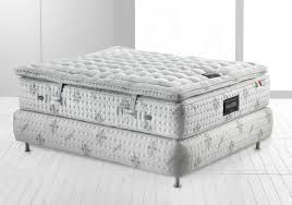 The substantial height of the combined mattress and foundation demonstrates the multi-layered construction that incorporates the Magniflex’s natural luxury materials and dual-core support system.