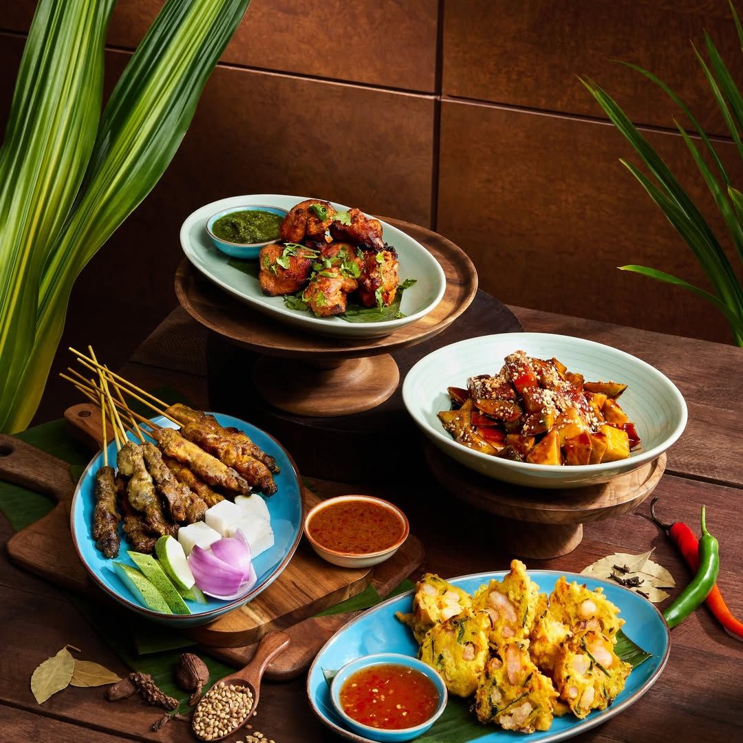 A selection of Malaysian delights featuring crispy cucur udang and juicy satay, only at JP Teres (Photo: Instagram / @grandhyattkualalumpur)