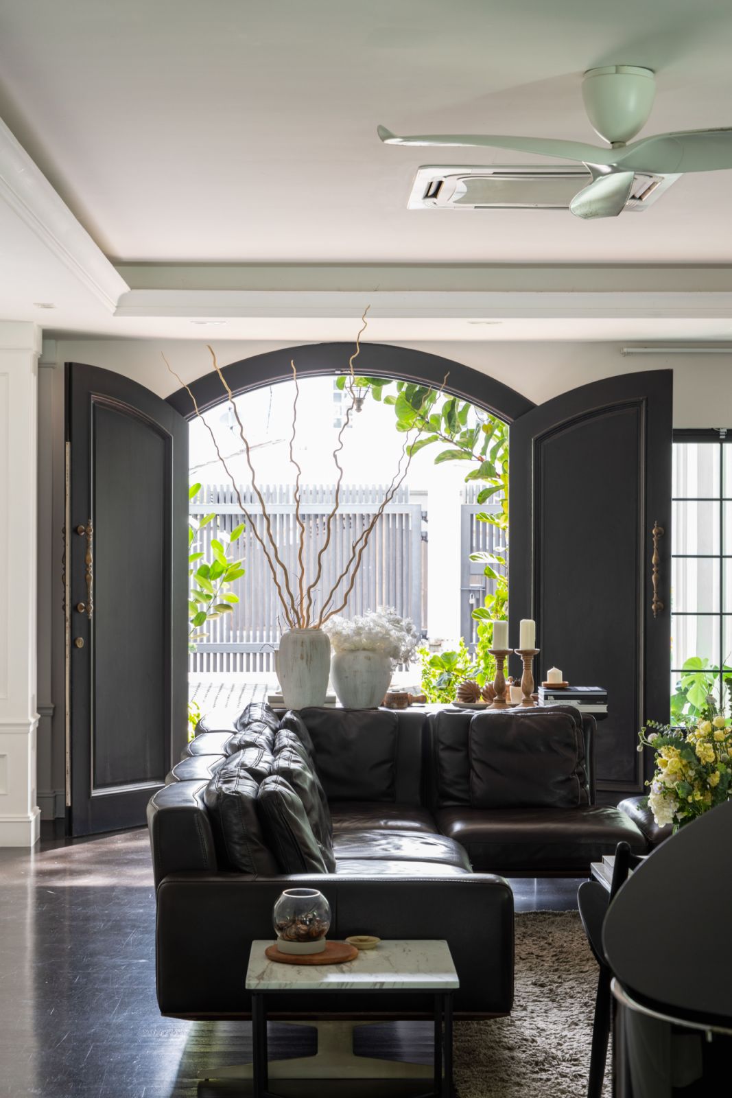 The grand entryway sets the tone with its harmonious blend of textures, warm lighting, and thoughtfully curated décor