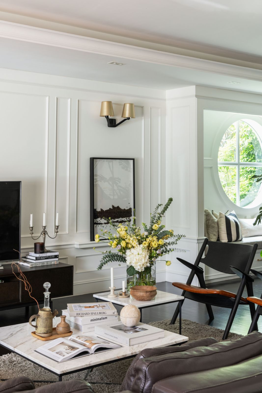 The custom-designed round window with an extended bench offers a cosy spot for contemplation