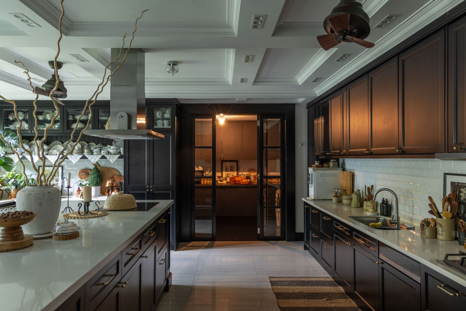 Custom cabinetry and premium appliances in the kitchen reflect the dual focus on aesthetic appeal and practical family living