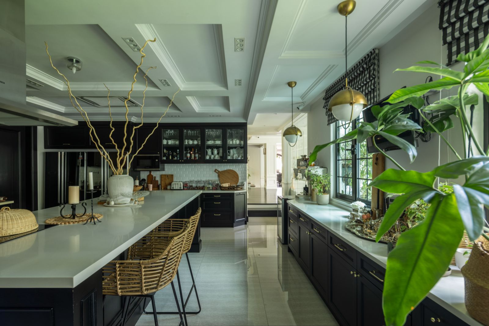 Attention to detail extends to the kitchen’s hardware and fixtures, with each element selected to contribute to the home’s neoclassical character