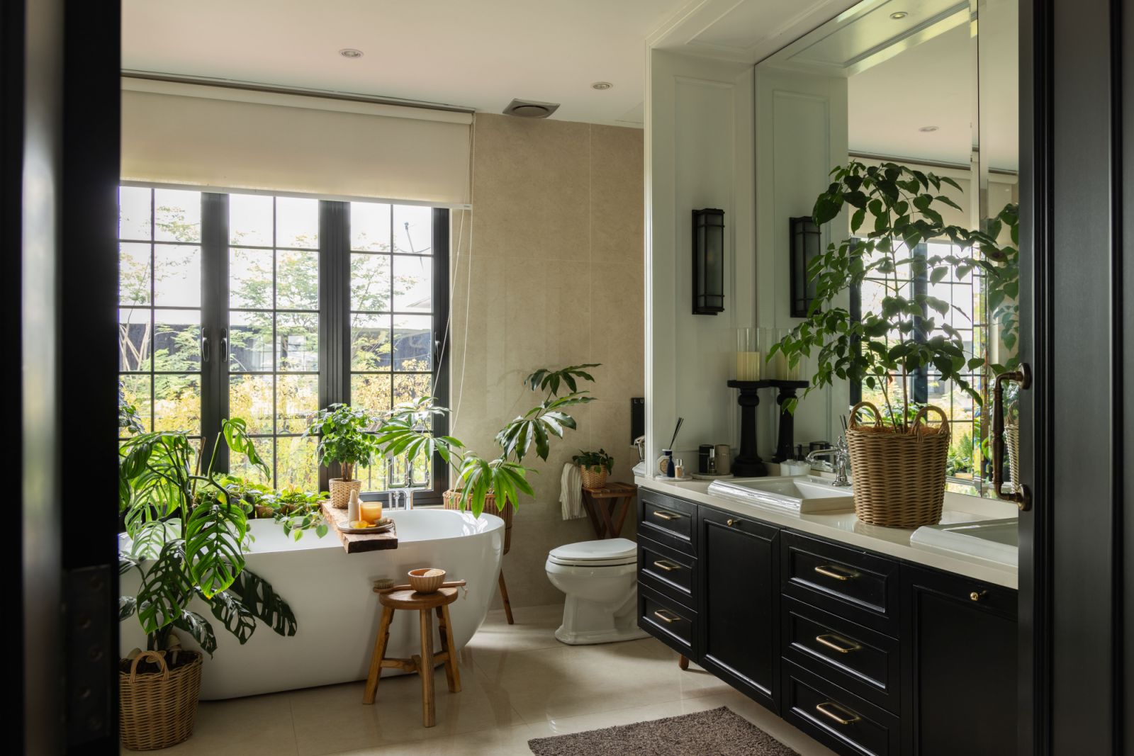 The master bathroom combines marble surfaces with custom brass fixtures