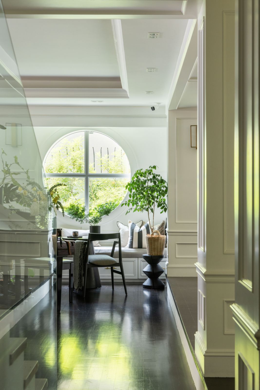 Views from the distinctive round window frame the lush surroundings