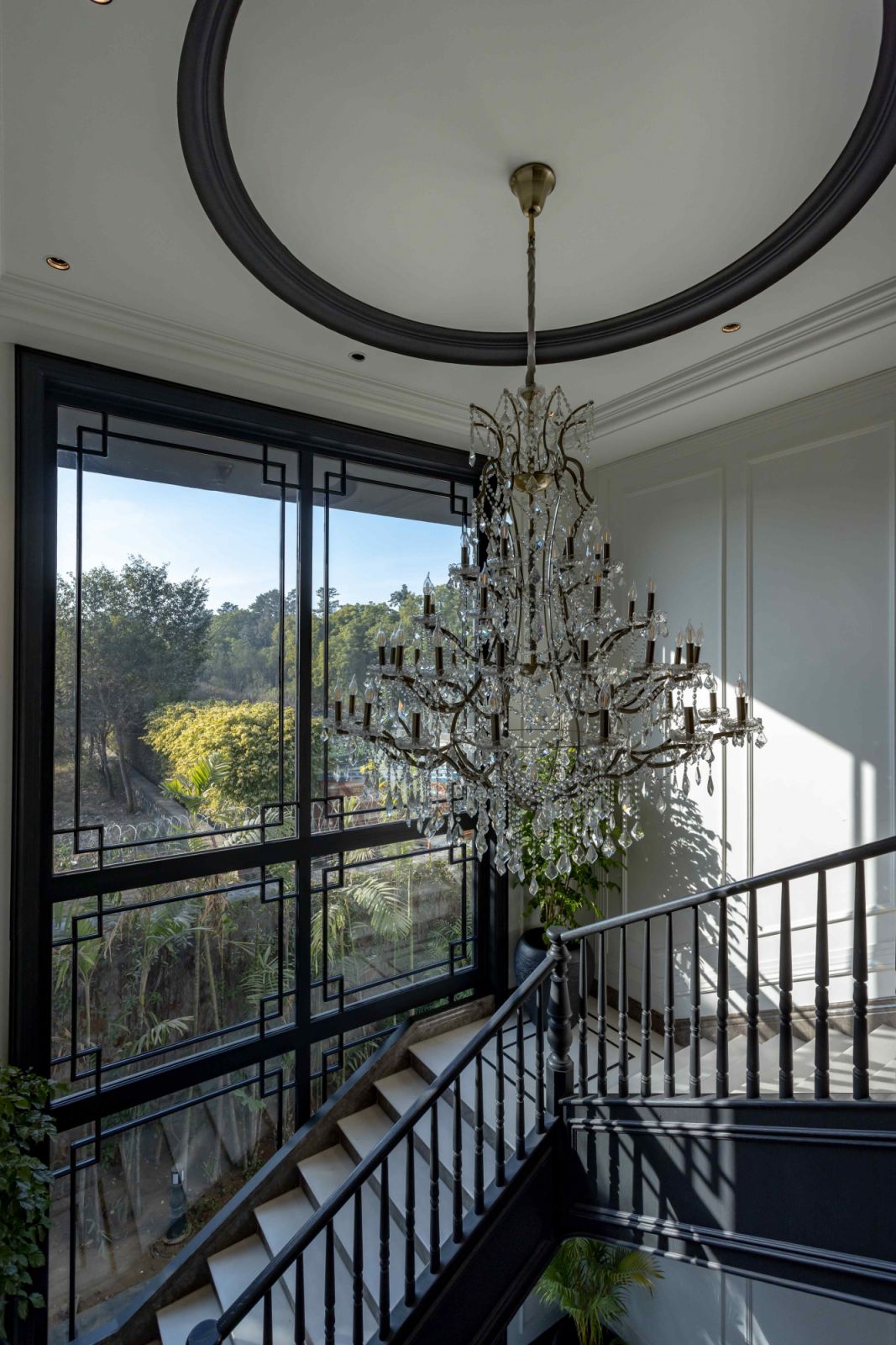 The elegant chandelier accentuates the classic interior