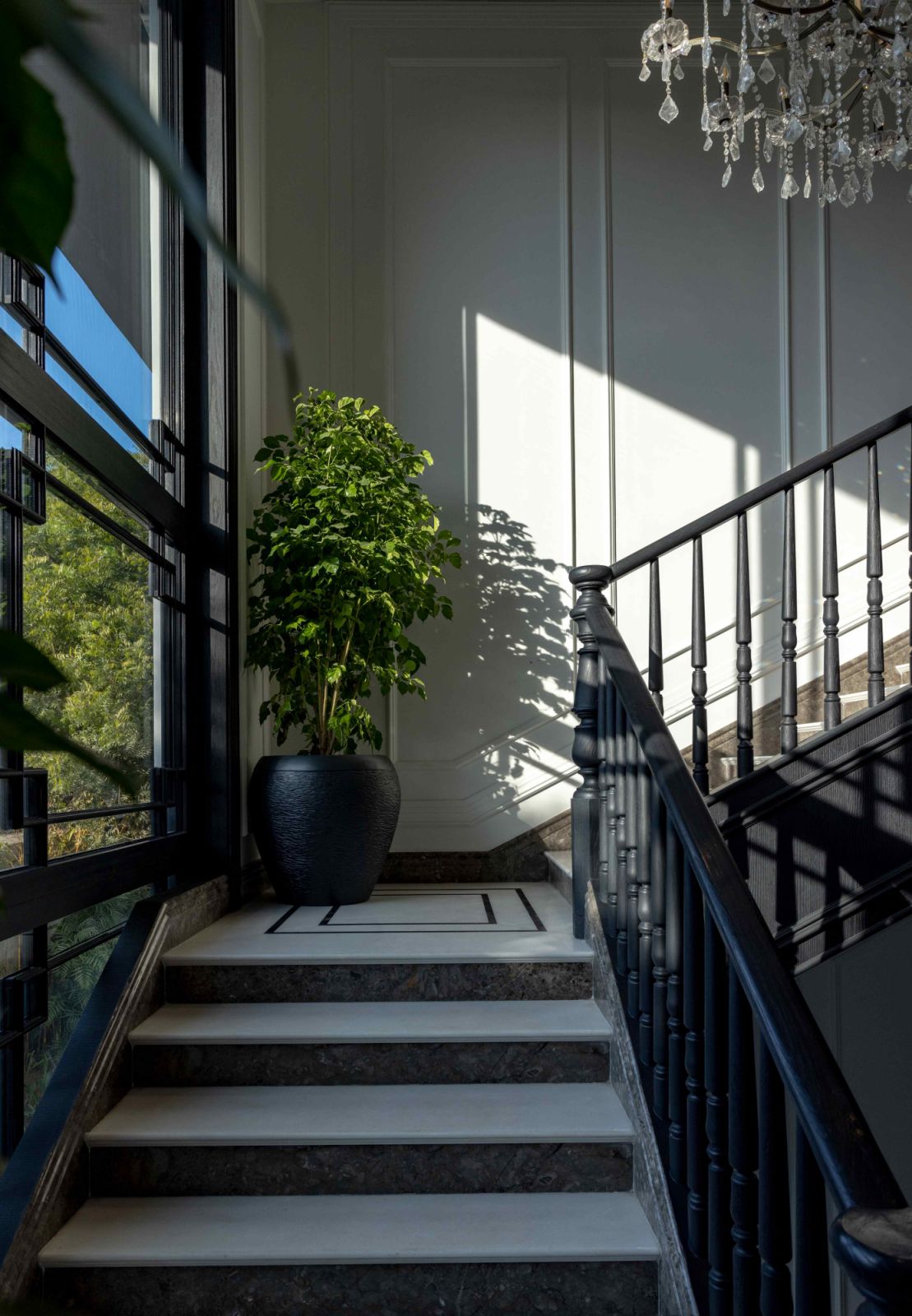 Western light casts dramatic shadows across the grand staircase