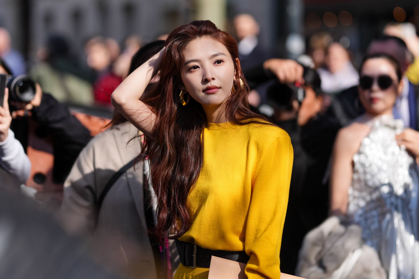 PARIS, FRANCE - MARCH 07: Ruonan Zhang wears dark green shoulder padded long sleeve dress, black leather belt, outside Givenchy, during the Paris Fashion week Women's Fall/Winter 2025-2026 on March 7, 2025 in Paris, France. (Photo by Edward Berthelot/Getty Images)