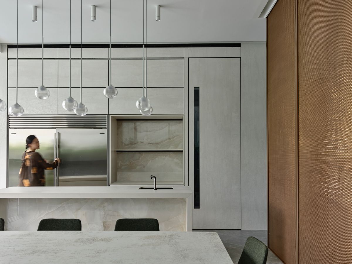 The predominantly grey kitchen features ample storage