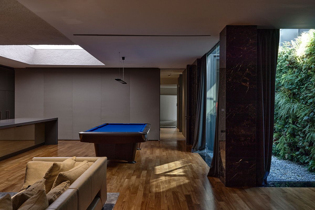 The family room enjoys natural light from a side garden