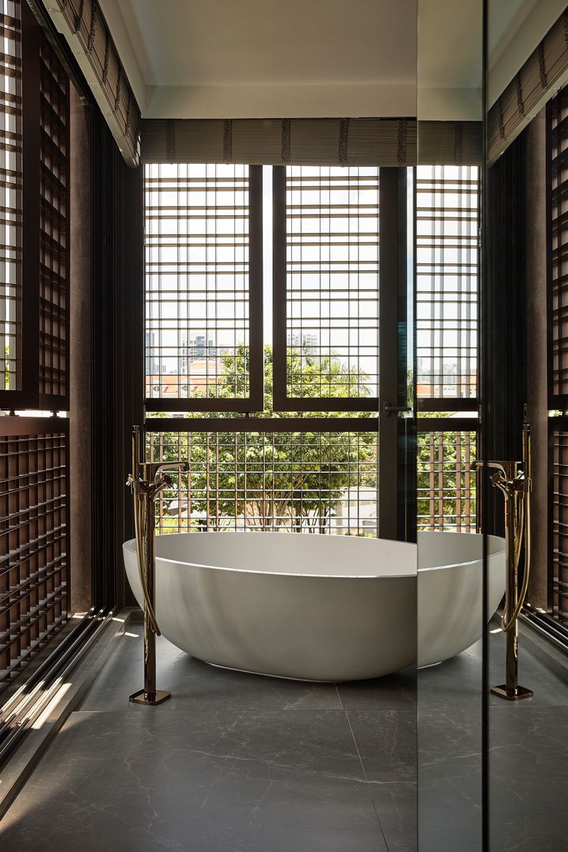 The screen frames the master bathroom's freestanding tub poetically