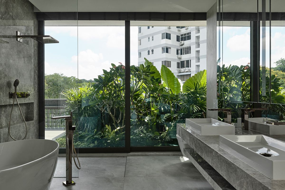 The freestanding bathtub and double vanity enjoy a sweeping view