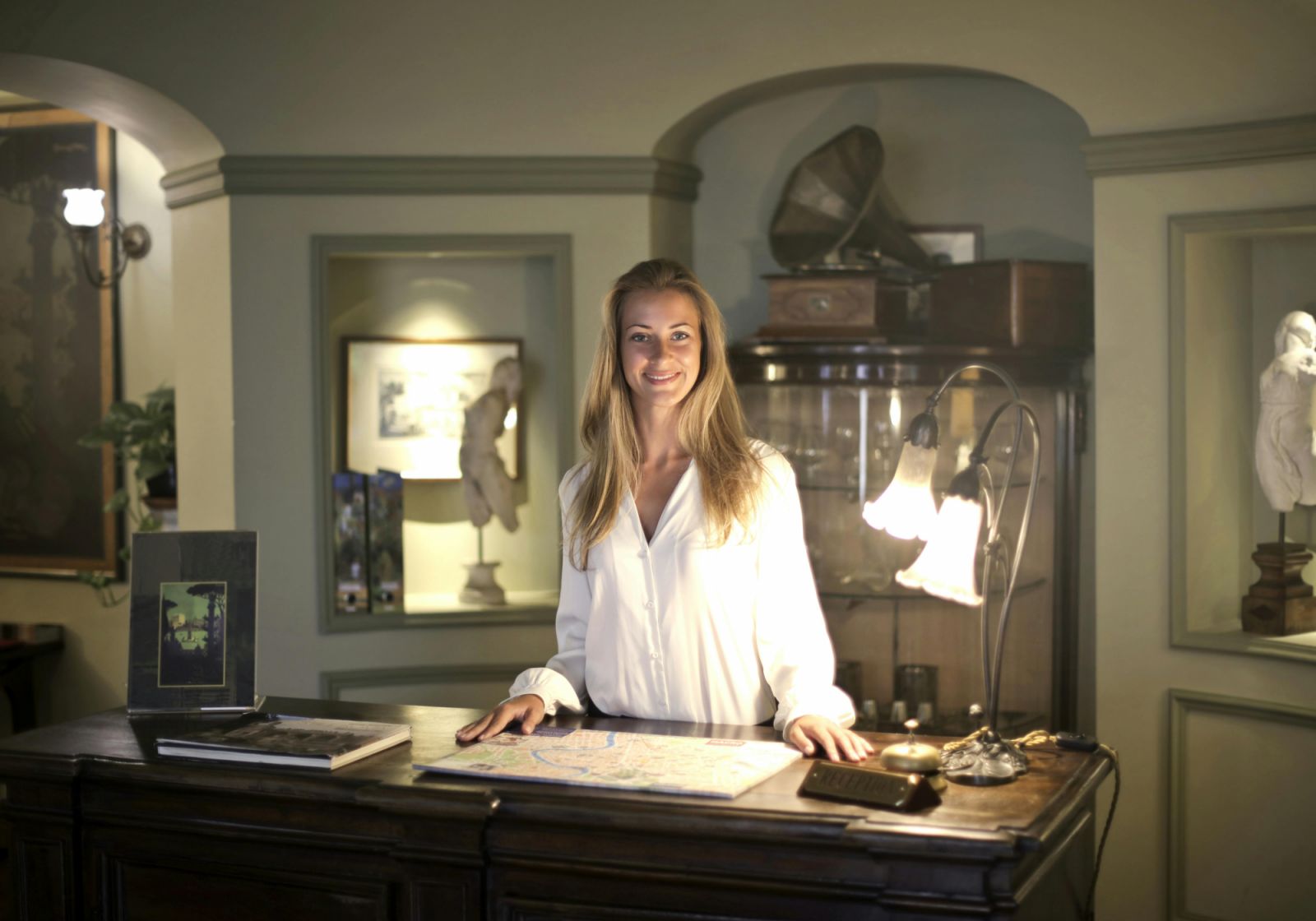 Blonde concierge behind a desk
