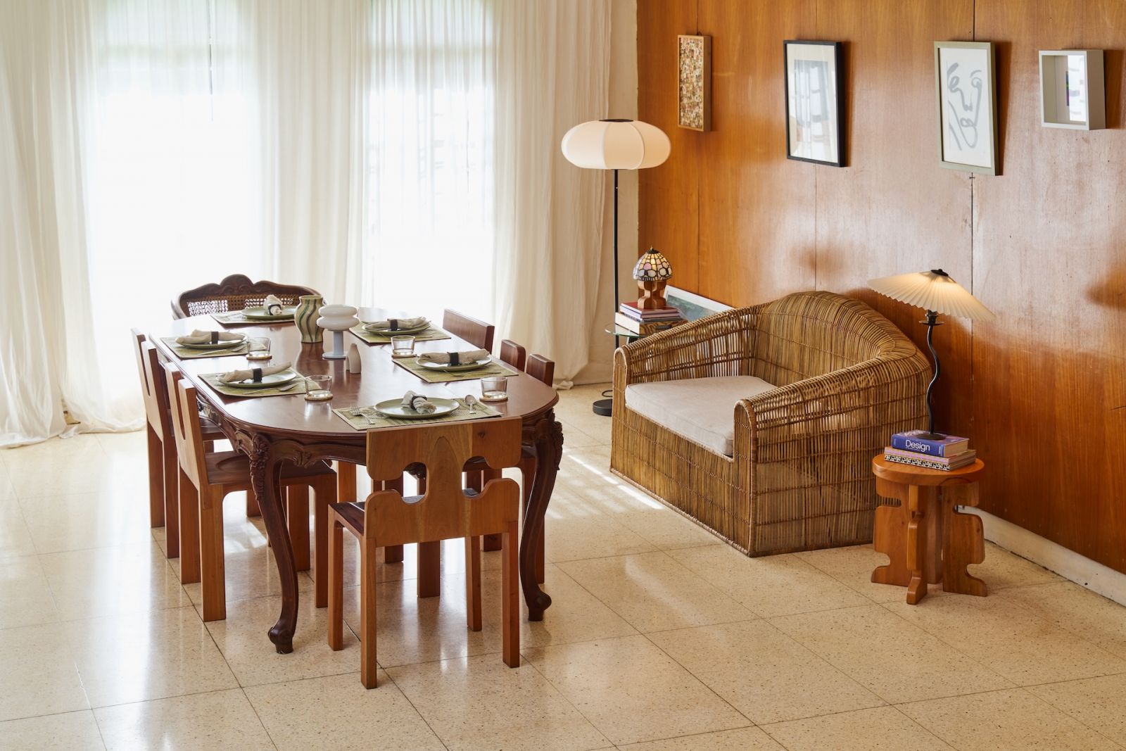 The dining area in a Marikina home, which features a two-seater sofa from furniture makers in Sogod, Cebu, with an Ikat woven blanket