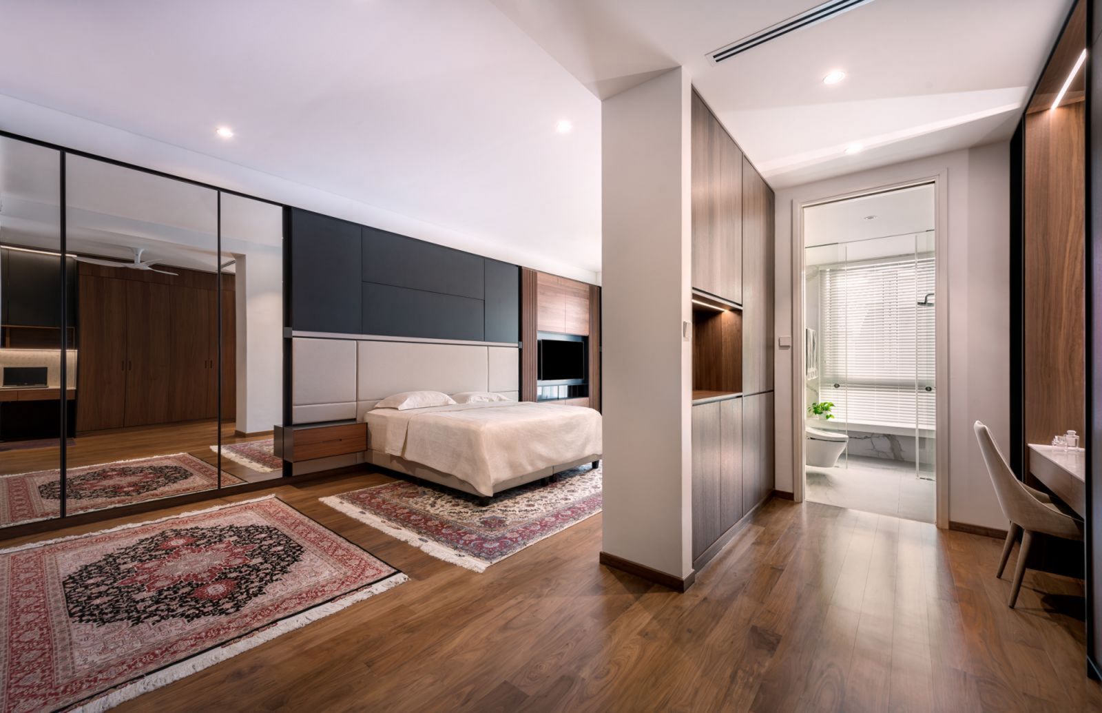 The spacious master bedroom on Faber Drive was divided into smaller zones for a more intimate ambience