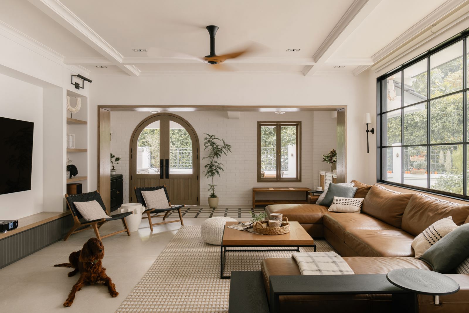 This Mediterranean-influenced Singapore home's living room is an airy space replete with well-articulated design details