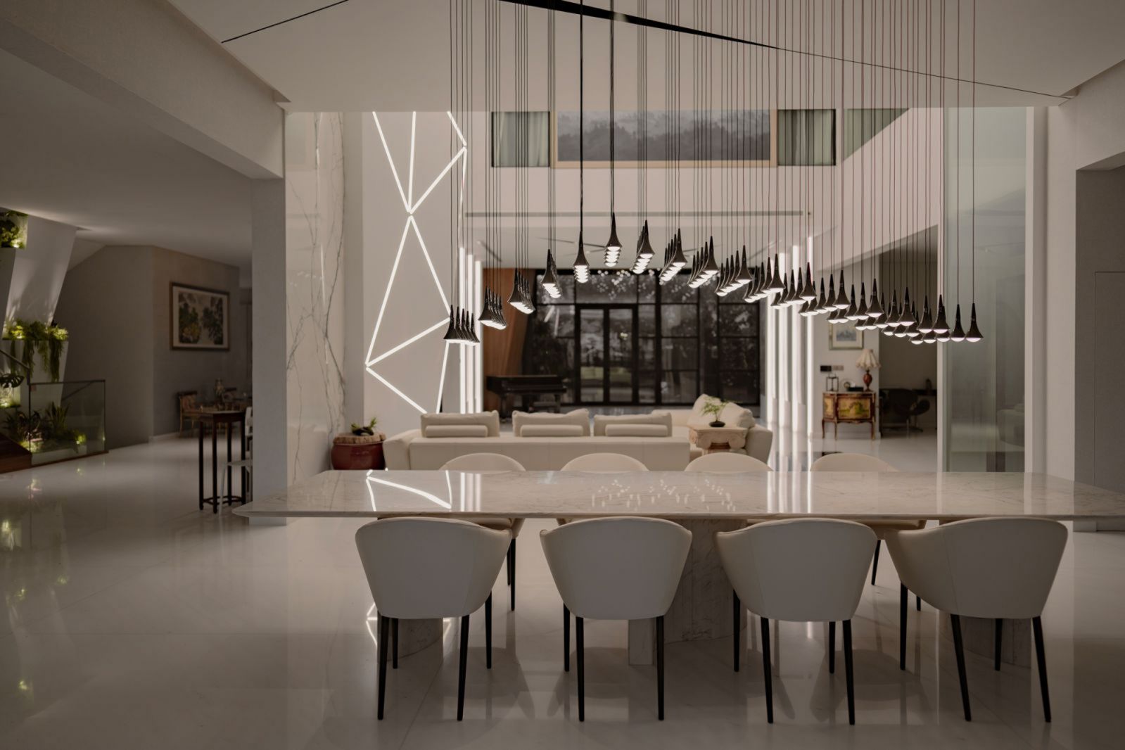 70 hanging raindrop lights evoke an enchanting atmosphere in this dining area, designed by Jia Studios