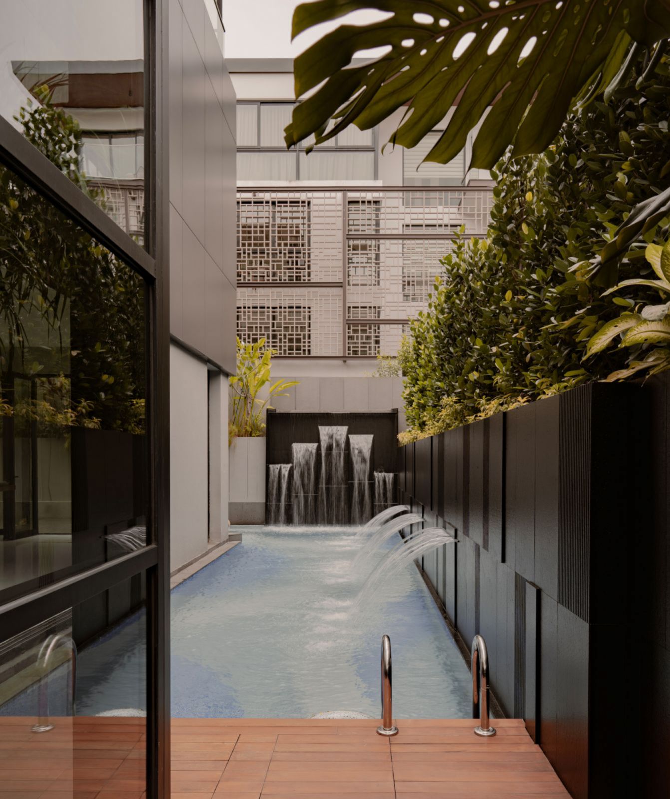 The pool area turns the outdoors of the Holland Grove home into an oasis