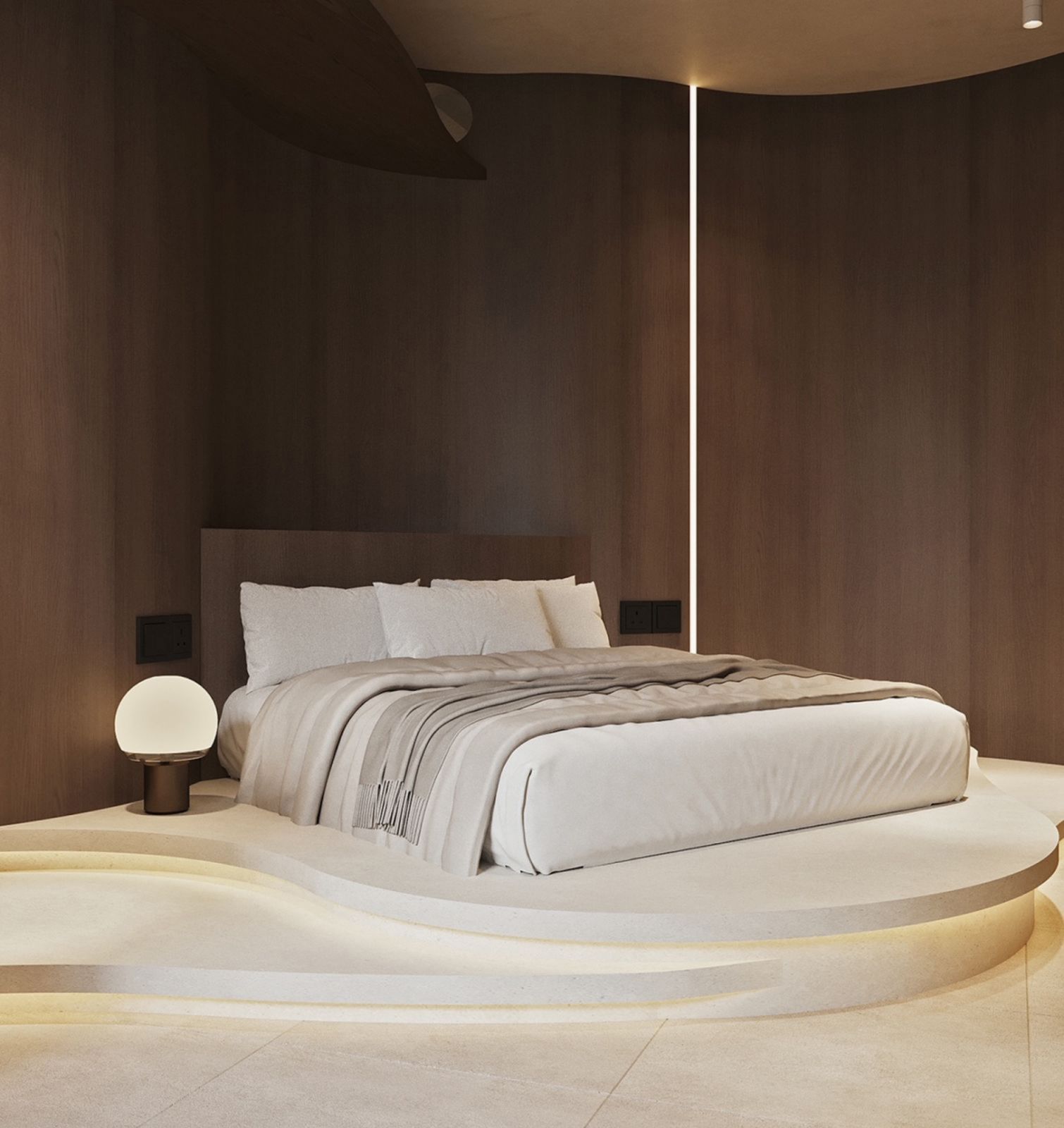 The bed is cocooned inside a gentle curve, the silhouette of the room inspired by an intimate cave