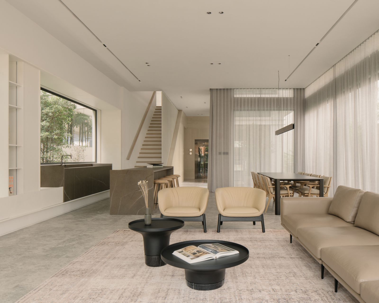 The neutral palette and light tones add to the feeling of restfulness in this living room by Sujonohun
