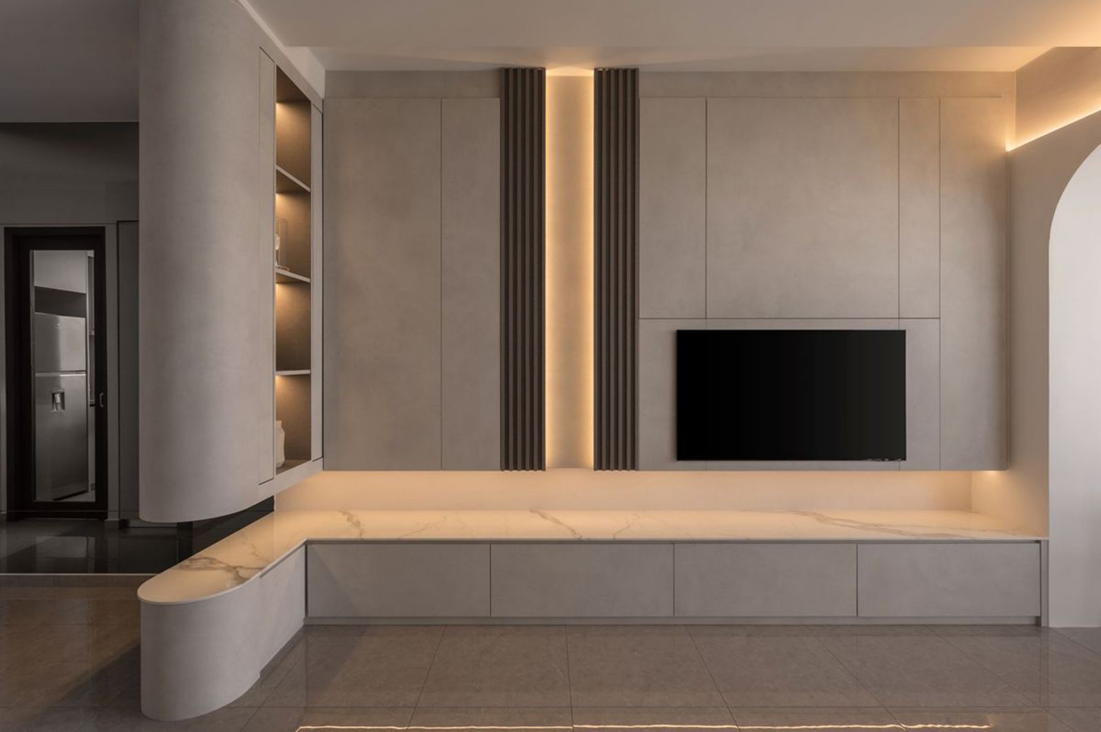 The living room’s impeccably crafted carpentry at this condominium apartment by Twothree Design comes with subtle lighting