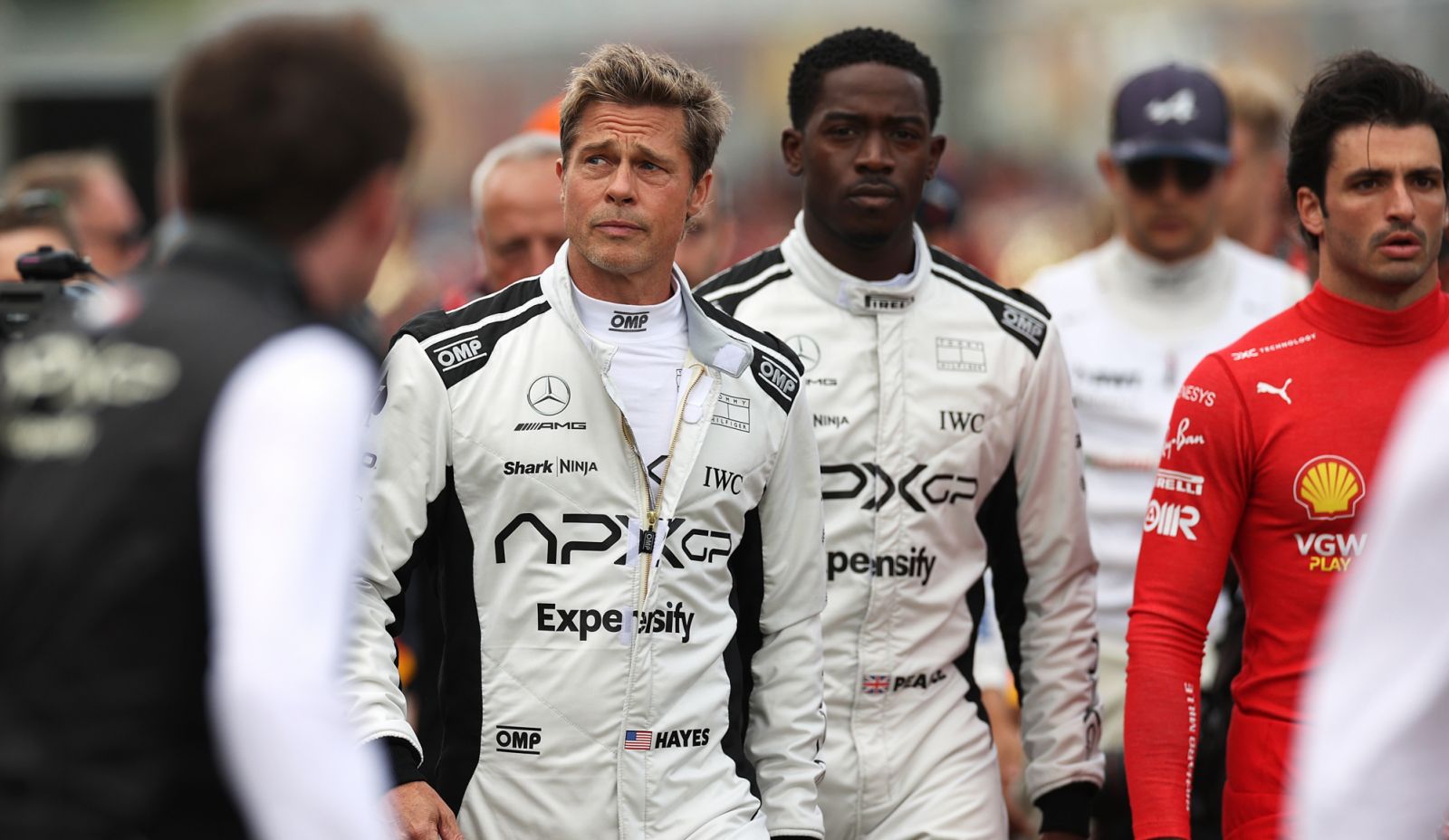 NORTHAMPTON, ENGLAND - JULY 09: Brad Pitt, star of the upcoming Formula One based movie, Apex, and Damson Idris, co-star of the upcoming Formula One based movie, Apex, walk on the grid during the F1 Grand Prix of Great Britain at Silverstone Circuit on July 09, 2023 in Northampton, England. (Photo by Ryan Pierse/Getty Images)